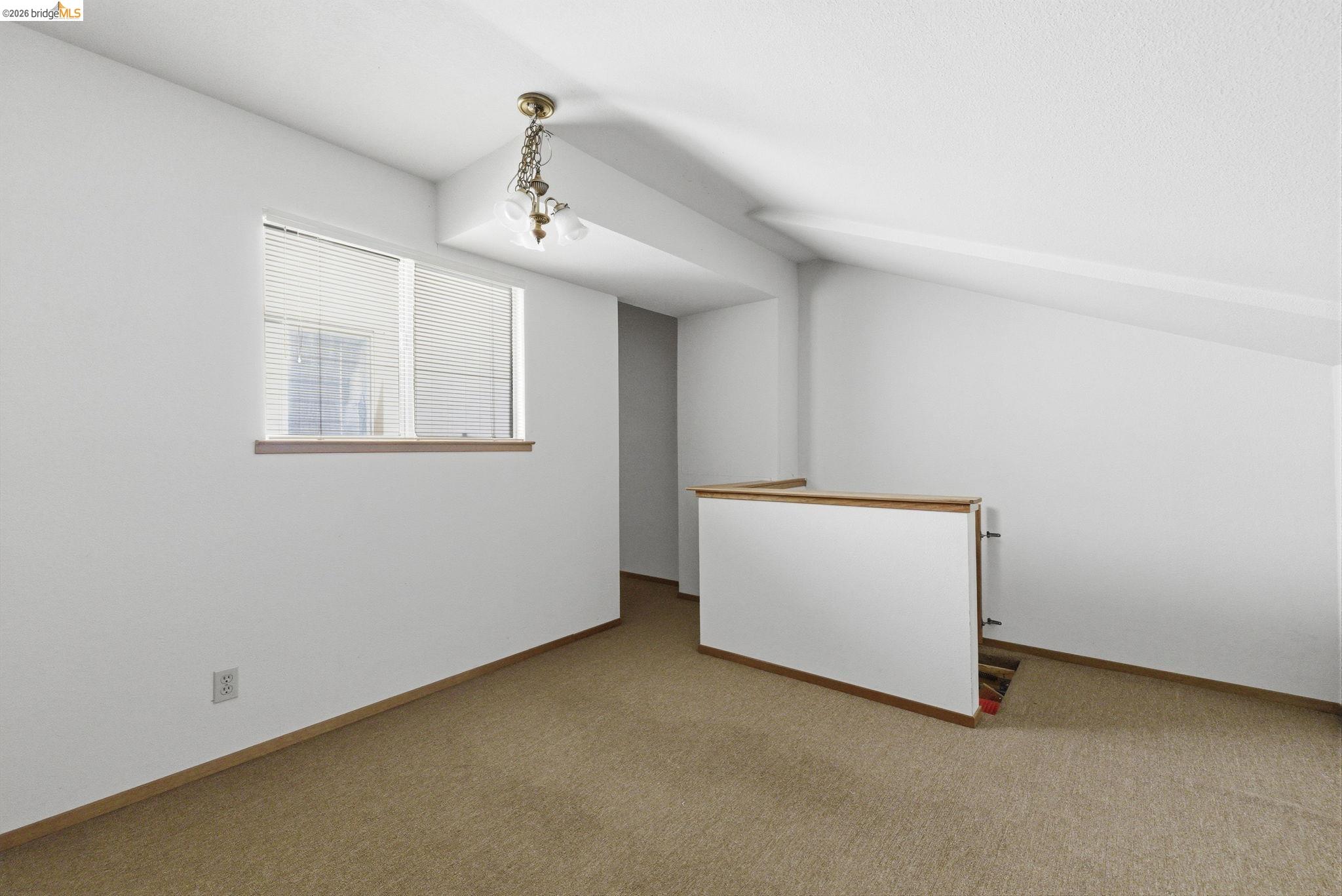 23685 Marble Quarry Road, Unit 8 Columbia, CA 95310 - Photo 12 of 25 an empty room with windows