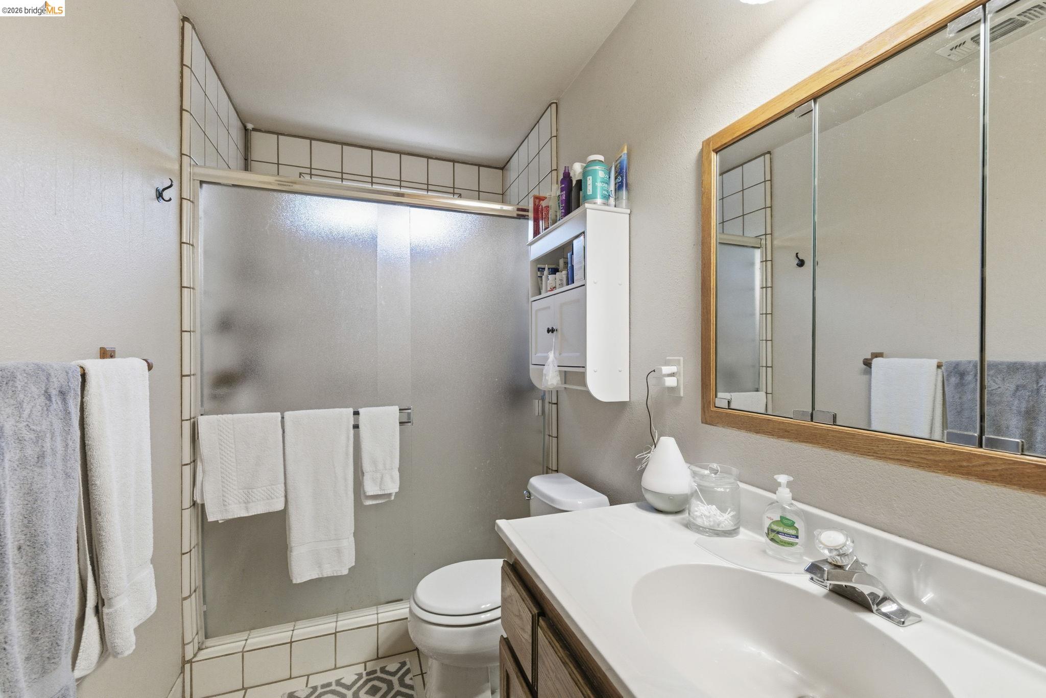 23685 Marble Quarry Road, Unit 8 Columbia, CA 95310 - Photo 15 of 25 a bathroom with a sink toilet and shower