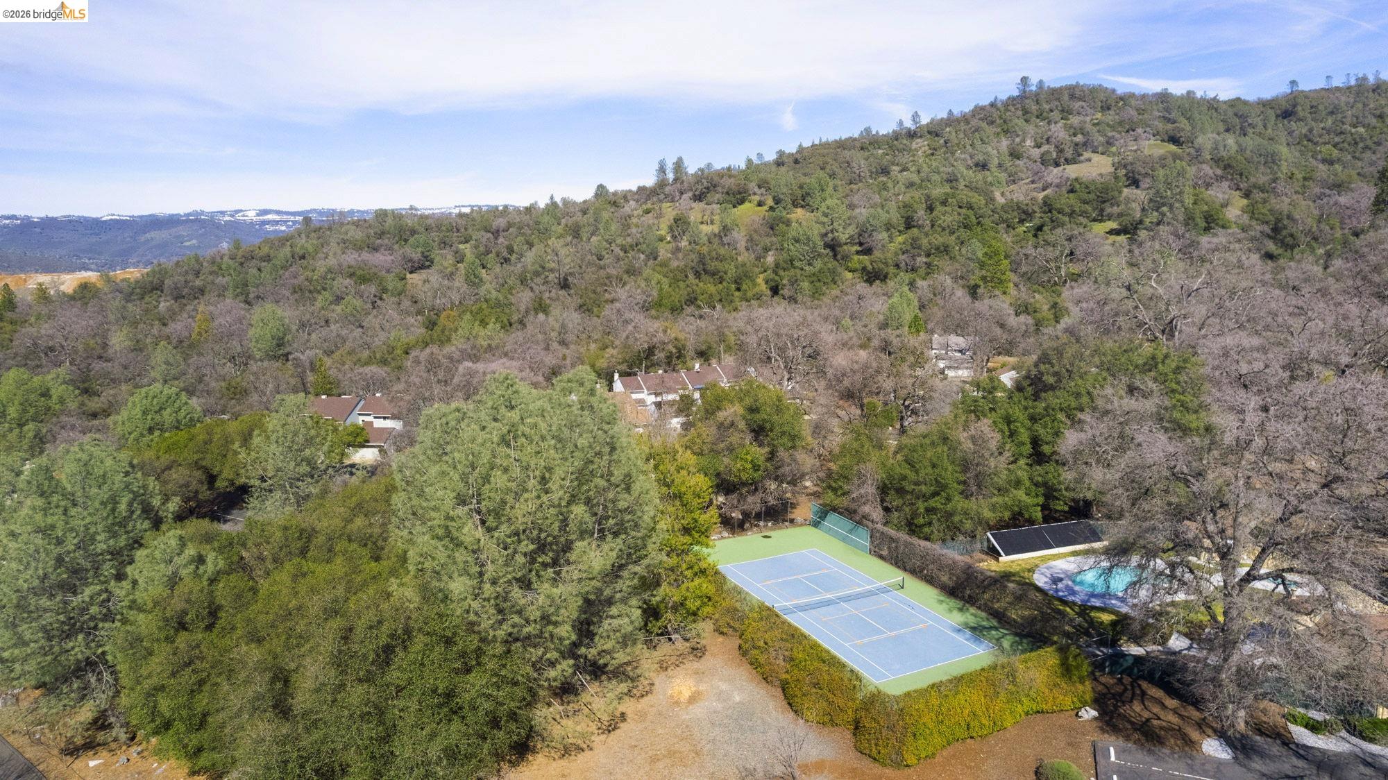 23685 Marble Quarry Road, Unit 8 Columbia, CA 95310 - Photo 22 of 25 an aerial view of a house with a yard