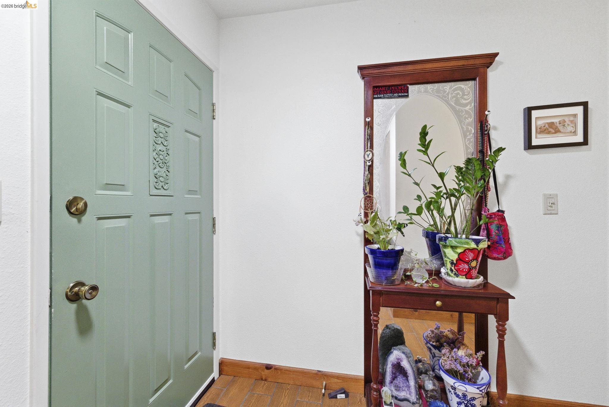 23685 Marble Quarry Road, Unit 8 Columbia, CA 95310 - Photo 3 of 25 a bathroom with a vase of flowers shower and a mirror