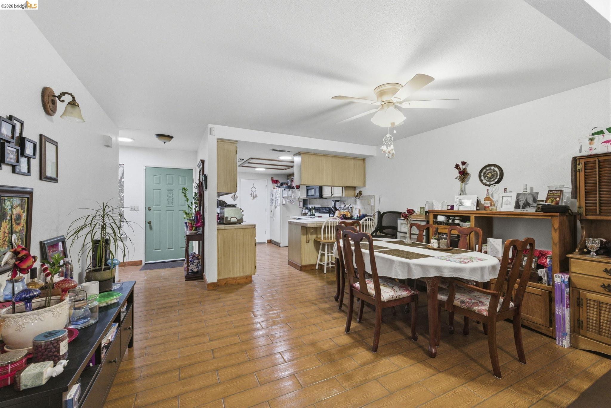 23685 Marble Quarry Road, Unit 8 Columbia, CA 95310 - Photo 4 of 25 a view of a dining room with furniture and a kitchen