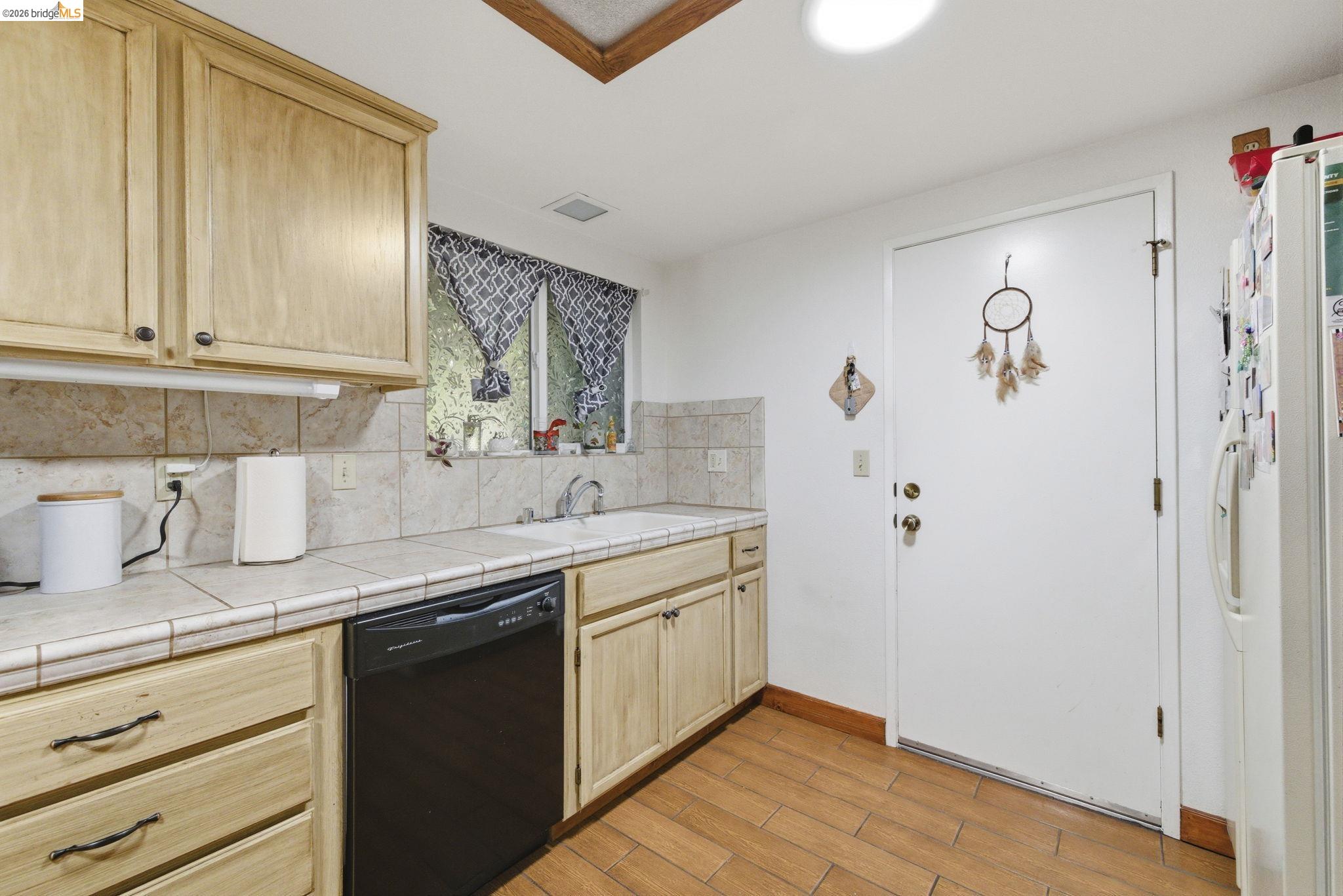 23685 Marble Quarry Road, Unit 8 Columbia, CA 95310 - Photo 6 of 25 a kitchen with a sink and cabinets