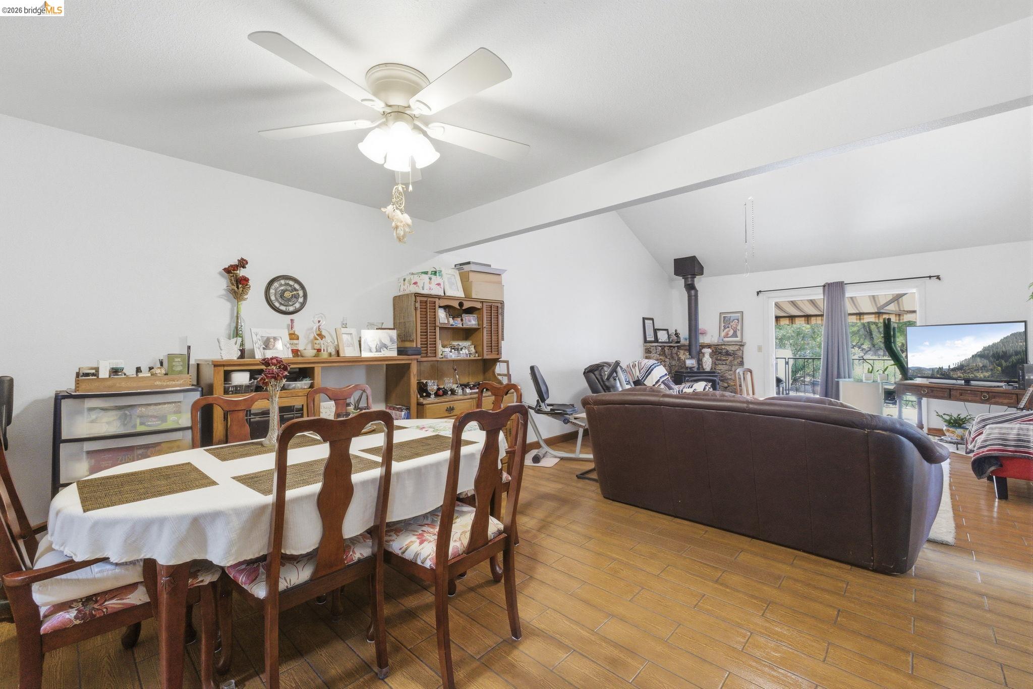 23685 Marble Quarry Road, Unit 8 Columbia, CA 95310 - Photo 8 of 25 a view of a dining room with furniture and wooden floor