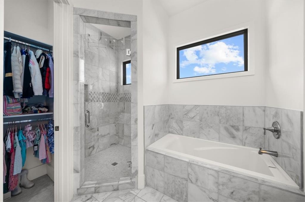 494 River Overlook Road Dawsonville, GA 30534 - Photo 50 of 96 a white bath tub sitting next to a bathroom