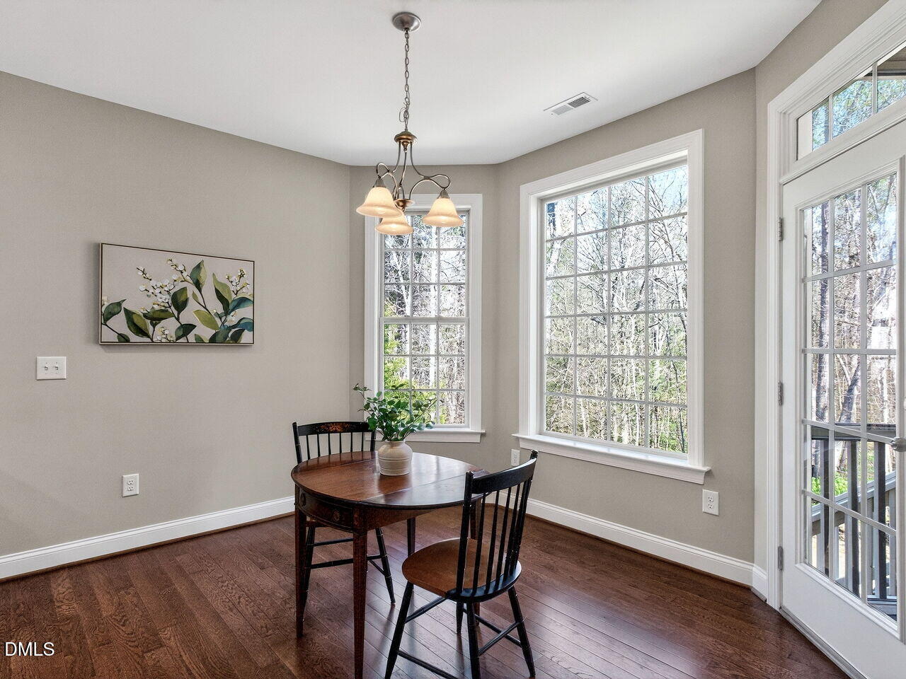 722 Toms Creek Road Cary, NC 27519 - Photo 12 of 42 a view of a dining room with furniture window and wooden floor