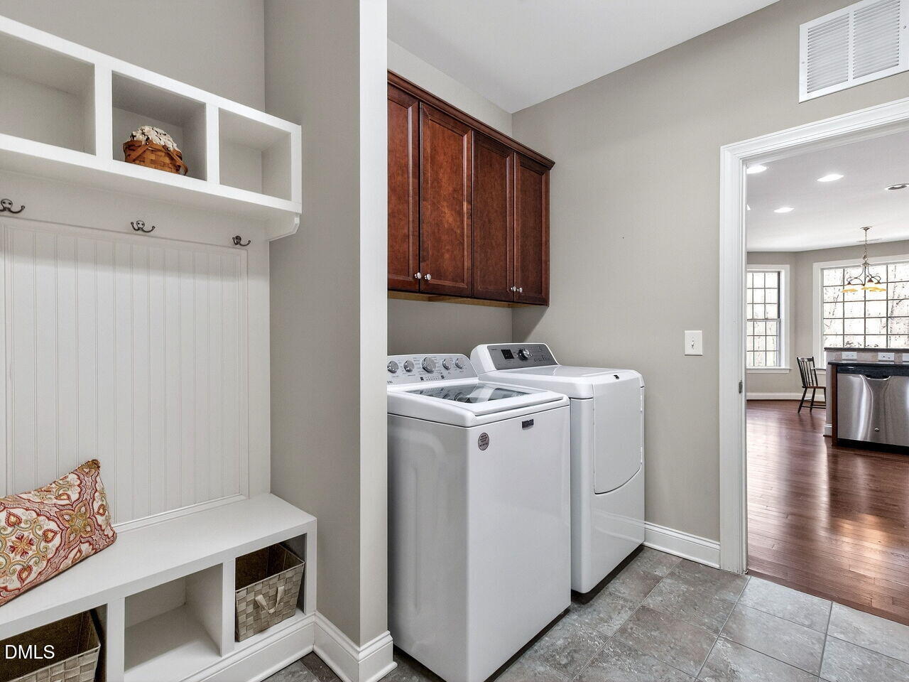 722 Toms Creek Road Cary, NC 27519 - Photo 17 of 42 a utility room with cabinets washer and dryer