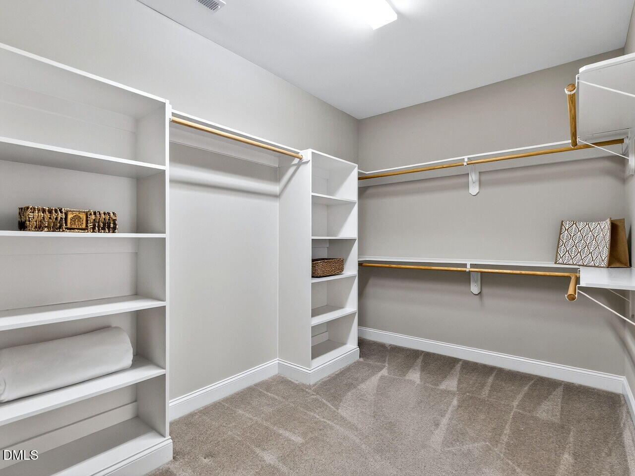 722 Toms Creek Road Cary, NC 27519 - Photo 21 of 42 a view of an empty walk in closet