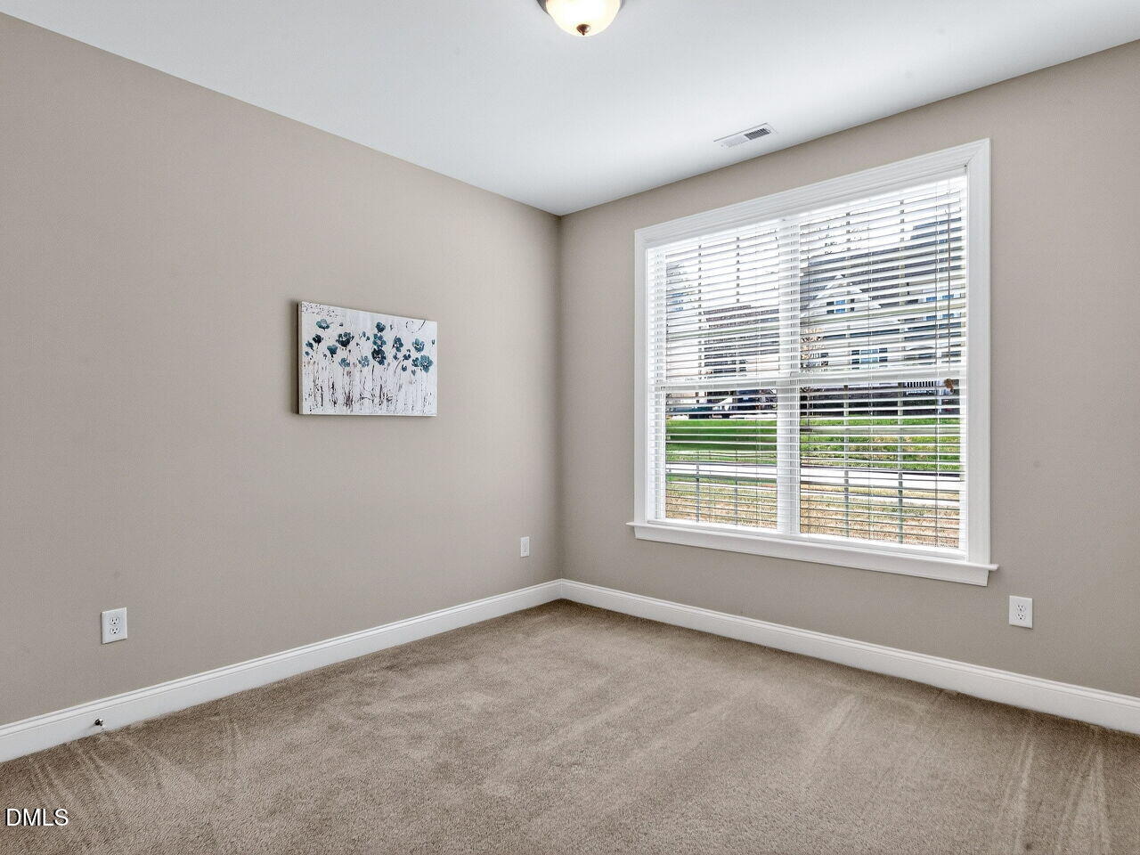 722 Toms Creek Road Cary, NC 27519 - Photo 22 of 42 a view of an empty room with a window