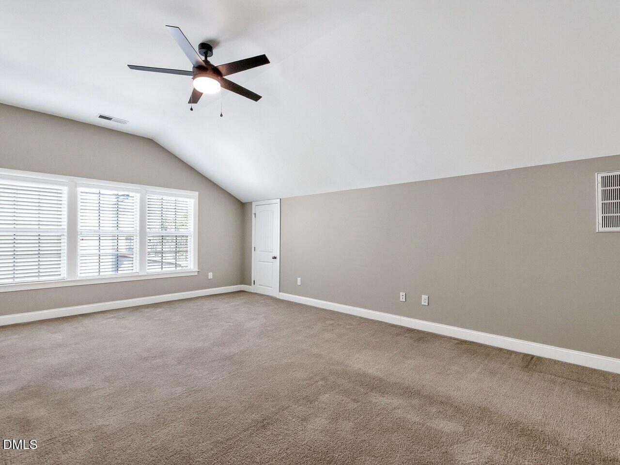 722 Toms Creek Road Cary, NC 27519 - Photo 25 of 42 an empty room with a ceiling fan and windows