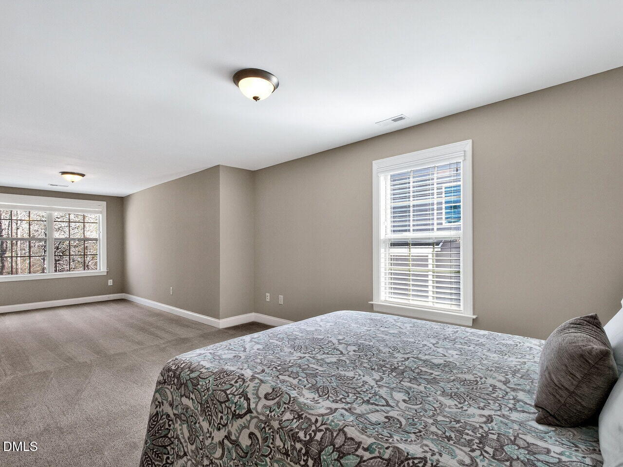 722 Toms Creek Road Cary, NC 27519 - Photo 28 of 42 a bedroom with a bed and a window