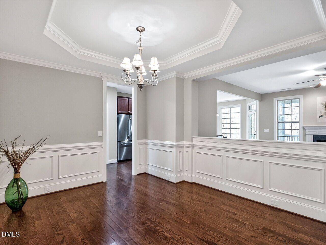 722 Toms Creek Road Cary, NC 27519 - Photo 8 of 42 a view of a livingroom with wooden floor and staircase