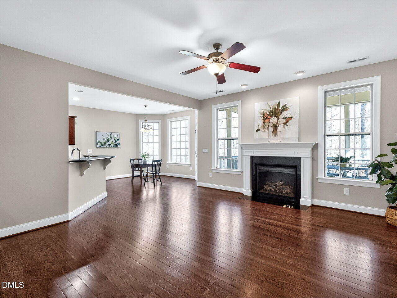 722 Toms Creek Road Cary, NC 27519 - Photo 10 of 42 a view of an empty room with wooden floor and a window