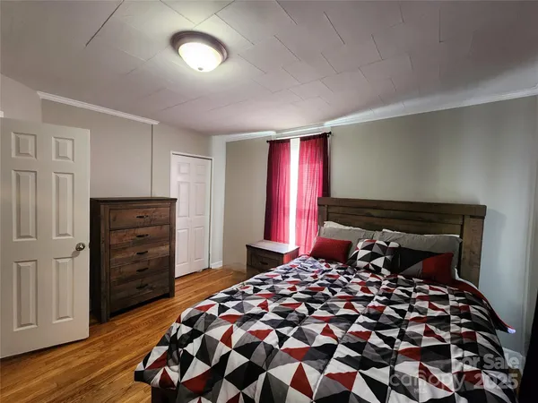 a bedroom with a bed and a closet