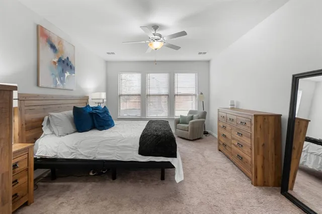 a bedroom with furniture and windows