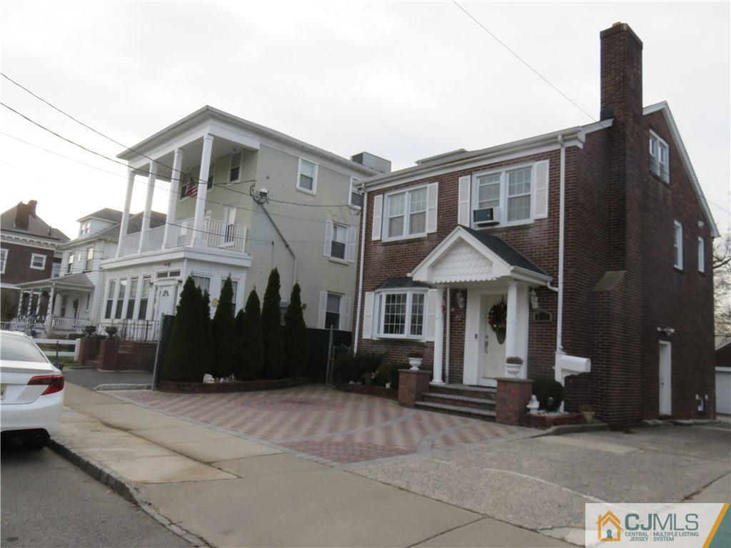 267 Rector Street Perth Amboy, NJ 08861 - Photo 1 of 17 a front view of a house with a garden