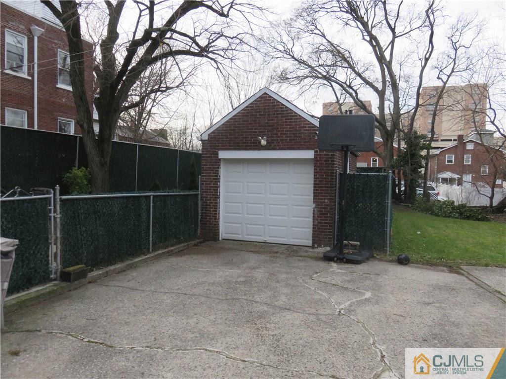 267 Rector Street Perth Amboy, NJ 08861 - Photo 2 of 17 a backyard of a house with lots of green space
