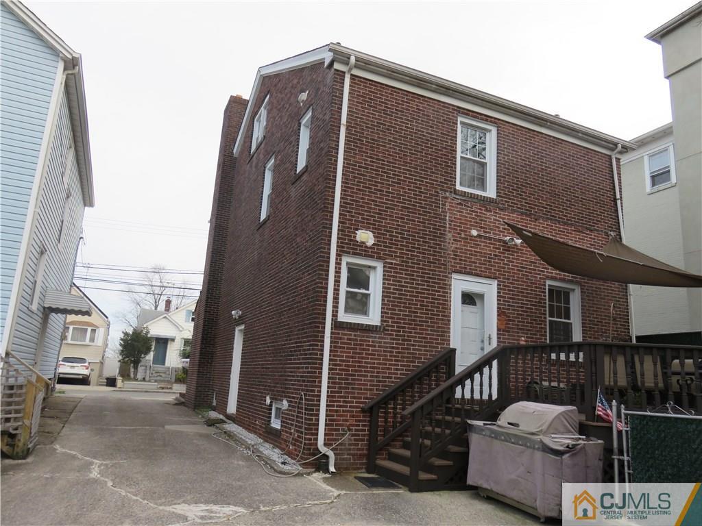 267 Rector Street Perth Amboy, NJ 08861 - Photo 3 of 17 a front view of a house with stairs