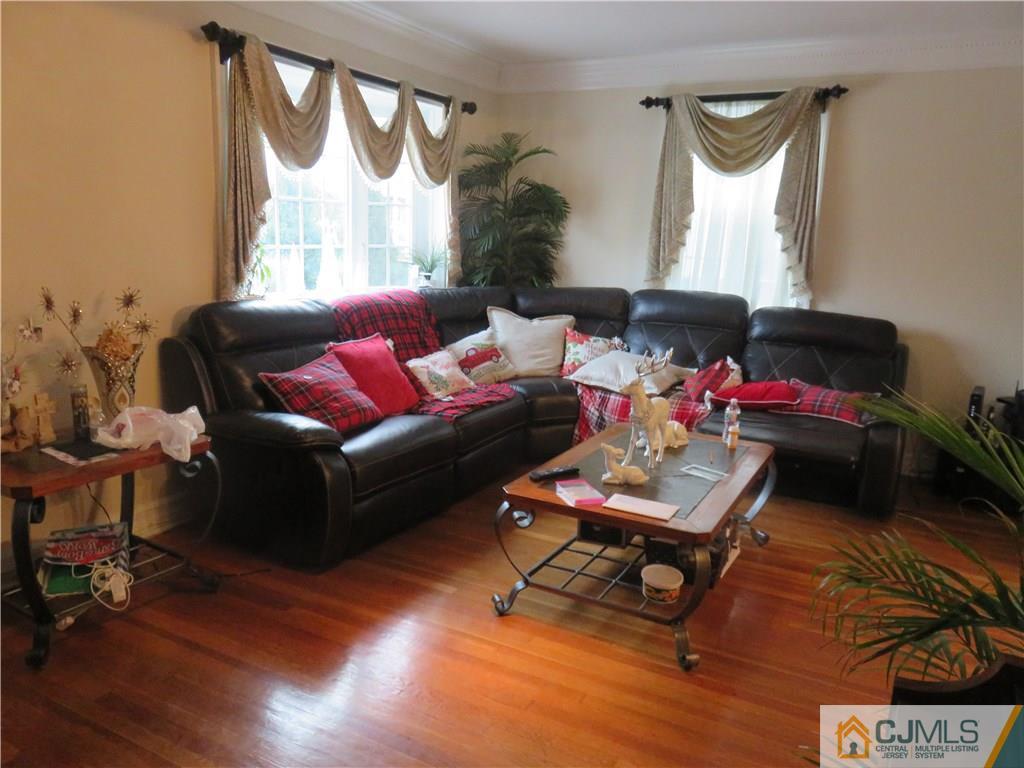 267 Rector Street Perth Amboy, NJ 08861 - Photo 4 of 17 a living room with furniture and a window