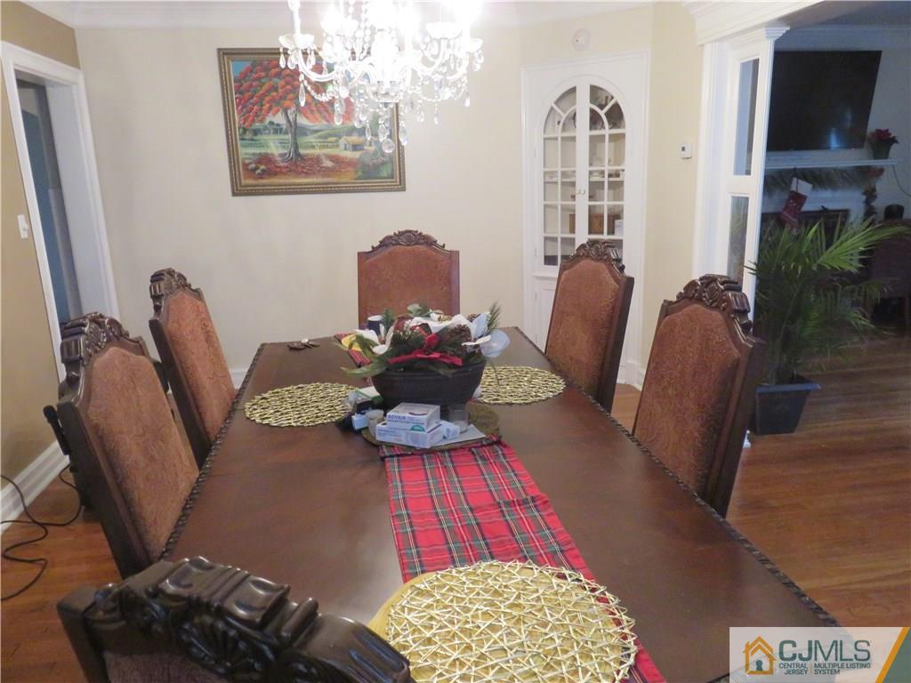 267 Rector Street Perth Amboy, NJ 08861 - Photo 5 of 17 a living room with furniture rug and a window
