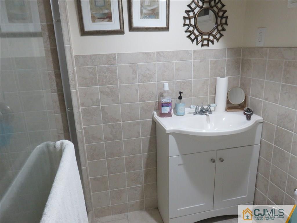267 Rector Street Perth Amboy, NJ 08861 - Photo 10 of 17 a bathroom with a sink and vanity