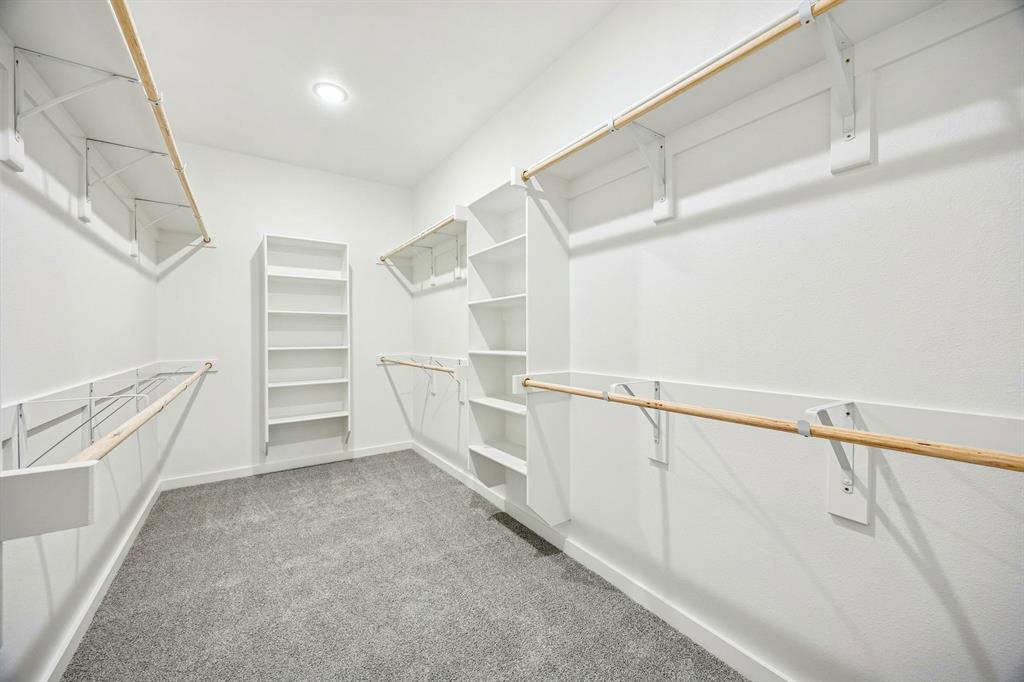 333 Millwood Road Lavon, TX 75166 - Photo 25 of 36 Primary Closet in the Willow home plan by Trophy Signature Homes – REPRESENTATIVE PHOTO
