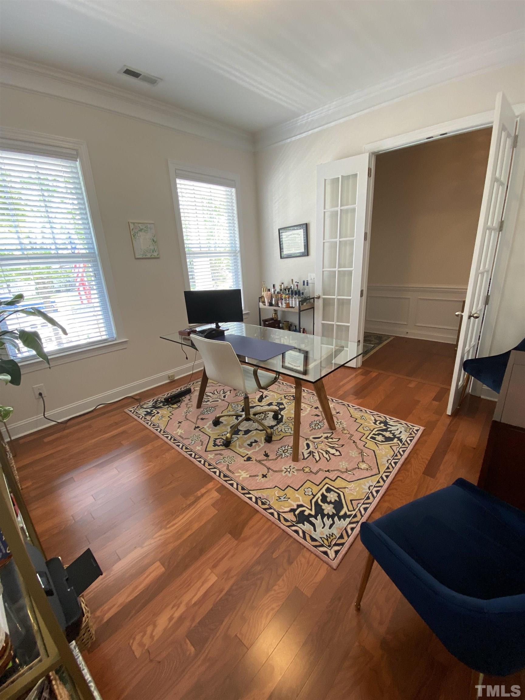 1116 Chapanoke Road Raleigh, NC 27603 - Photo 4 of 42 a living room with a couch and a rug