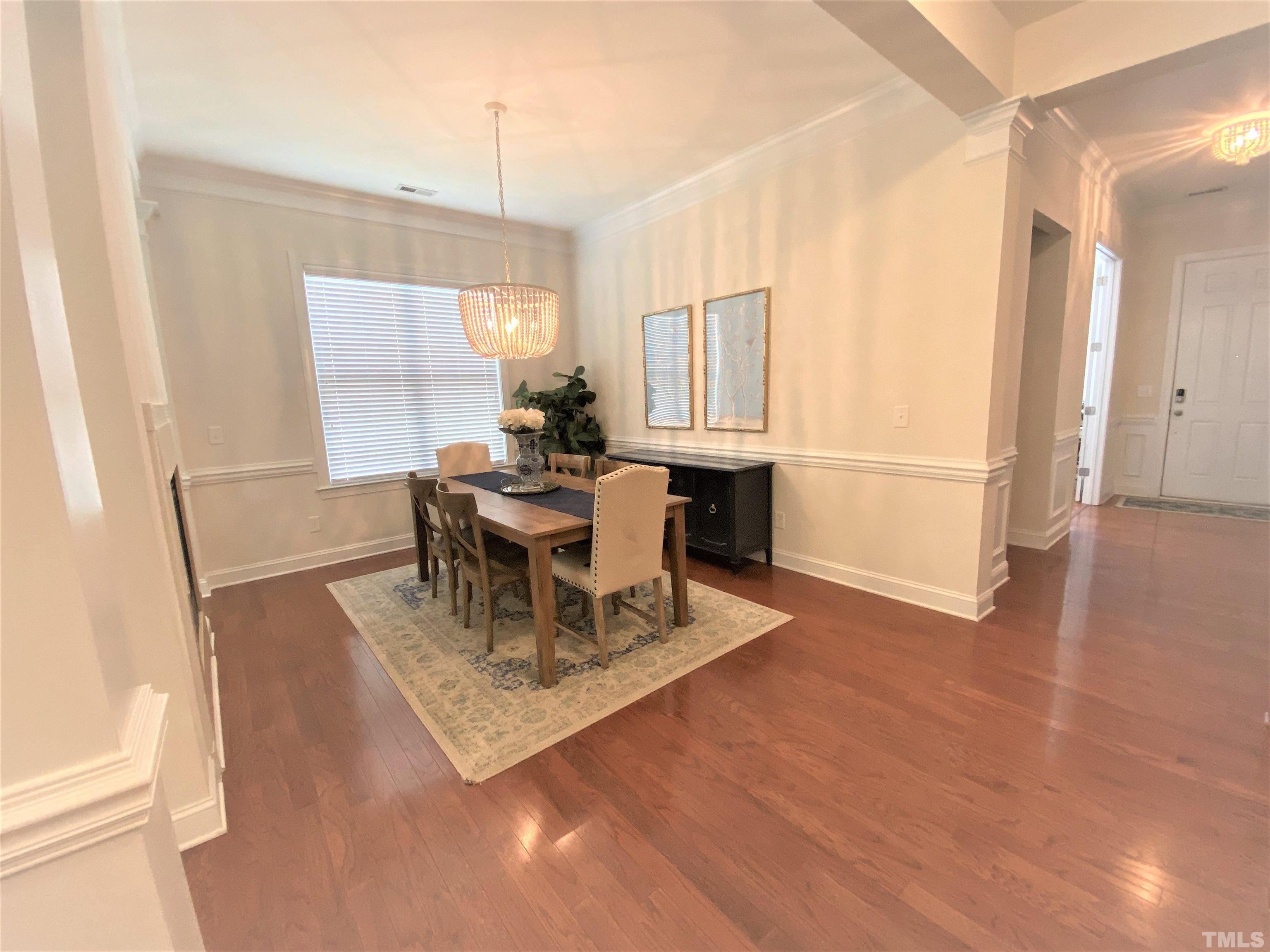1116 Chapanoke Road Raleigh, NC 27603 - Photo 6 of 42 a living room with furniture a window and wooden floor
