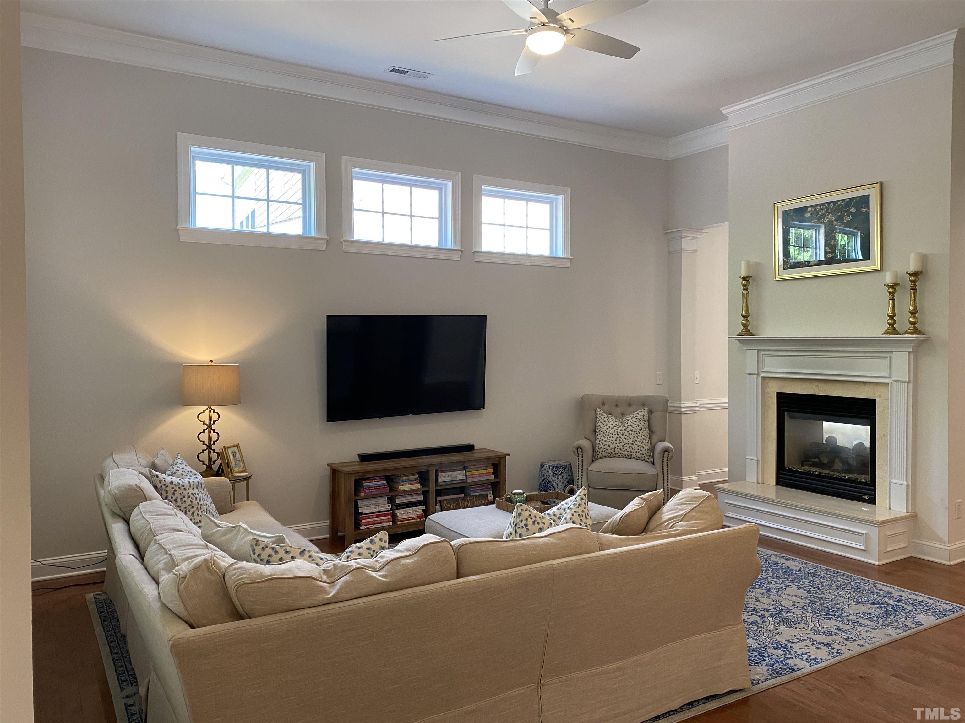 1116 Chapanoke Road Raleigh, NC 27603 - Photo 8 of 42 a living room with furniture and a flat screen tv