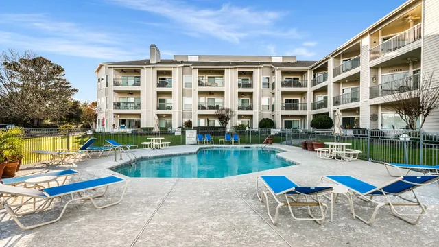 a view of a swimming pool with a lounge chairs