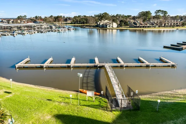 an aerial view of a house with a lake view