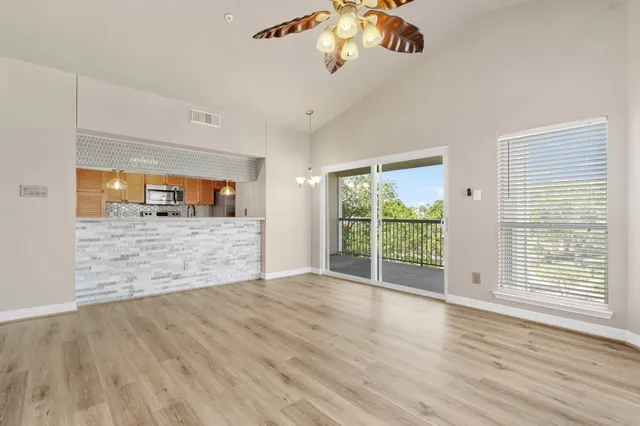 a view of a livingroom with wooden floor
