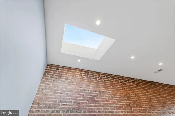 a bathroom with a shower sink and mirror