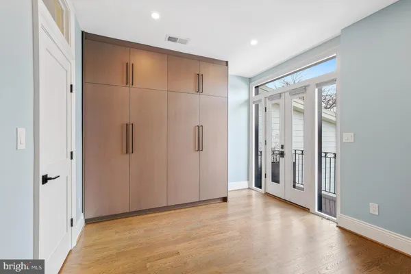 a view of room with door and a closet