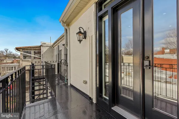 a view of a balcony with furniture
