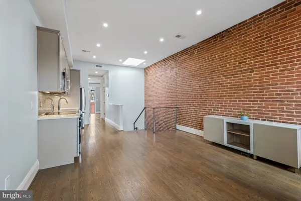 a view of a brick wall with a window