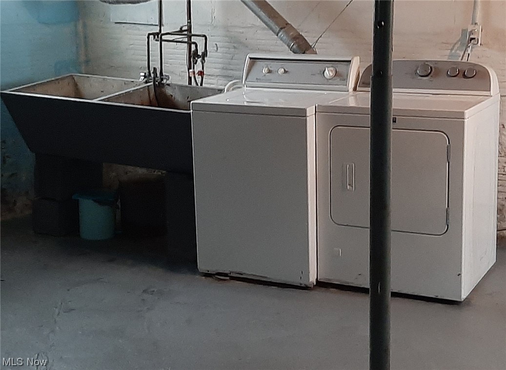1607 Breiding Road Akron, OH 44310 - Photo 11 of 15 Laundry area in the basement featuring washing machine and dryer