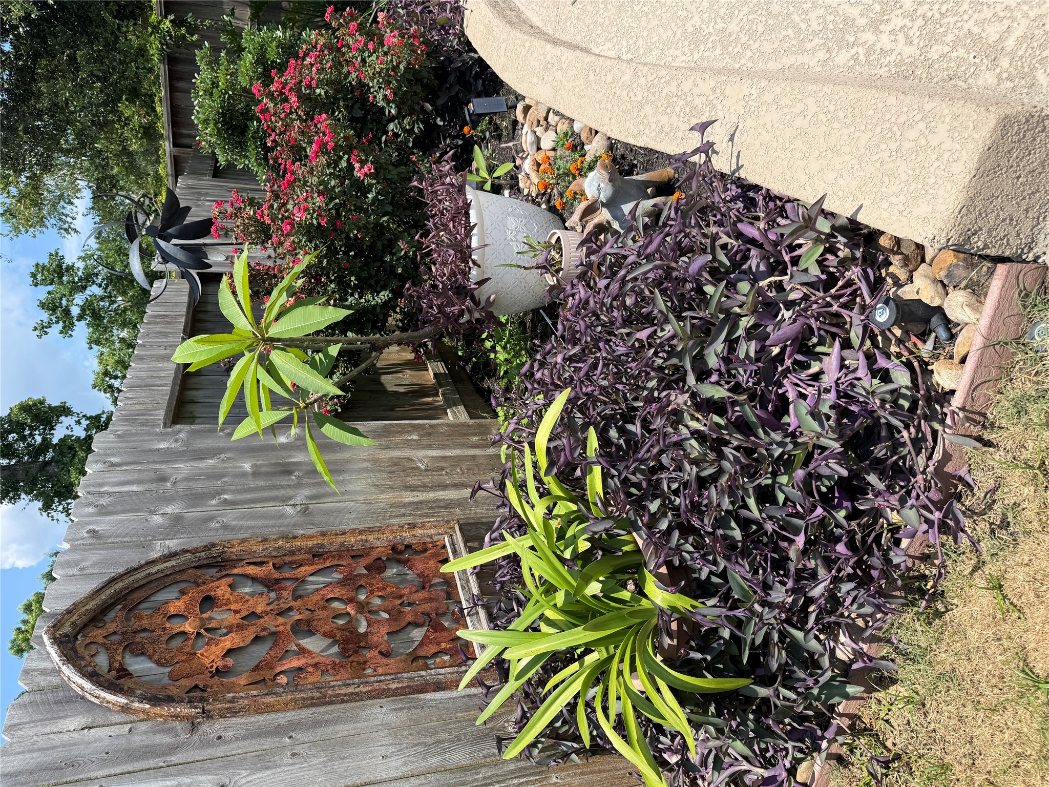 2336 Hagerman Road Conroe, TX 77384 - Photo 30 of 35 a view of a backyard with plants and flowers