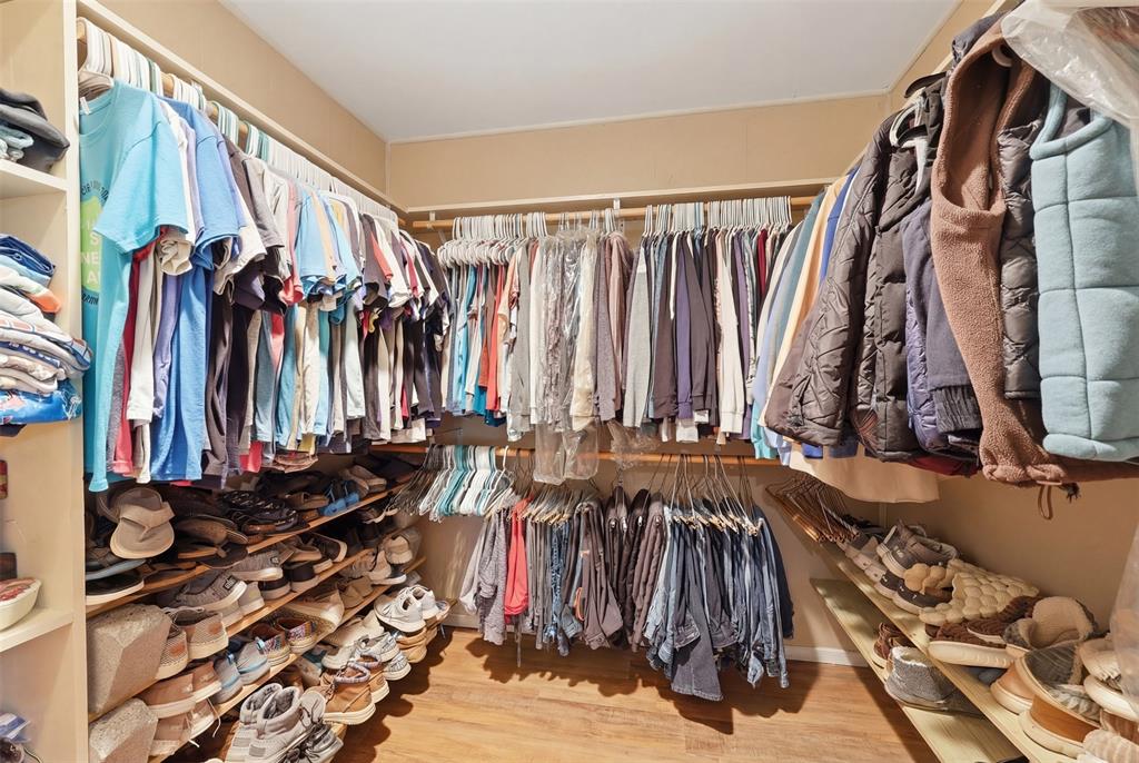 1644 County Road 195 Dublin, TX 76446 - Photo 14 of 34 a view of walk in closet with clothes