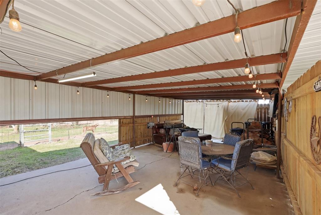 1644 County Road 195 Dublin, TX 76446 - Photo 20 of 34 a patio with patio table and chairs