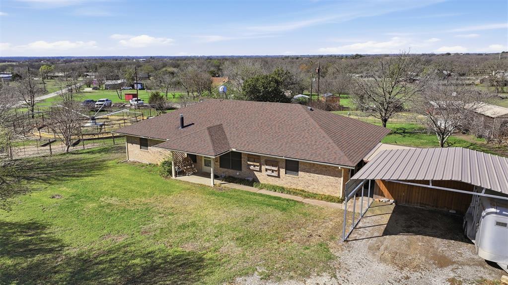 1644 County Road 195 Dublin, TX 76446 - Photo 2 of 34 an aerial view of a house with a yard swimming pool and mountain view in back