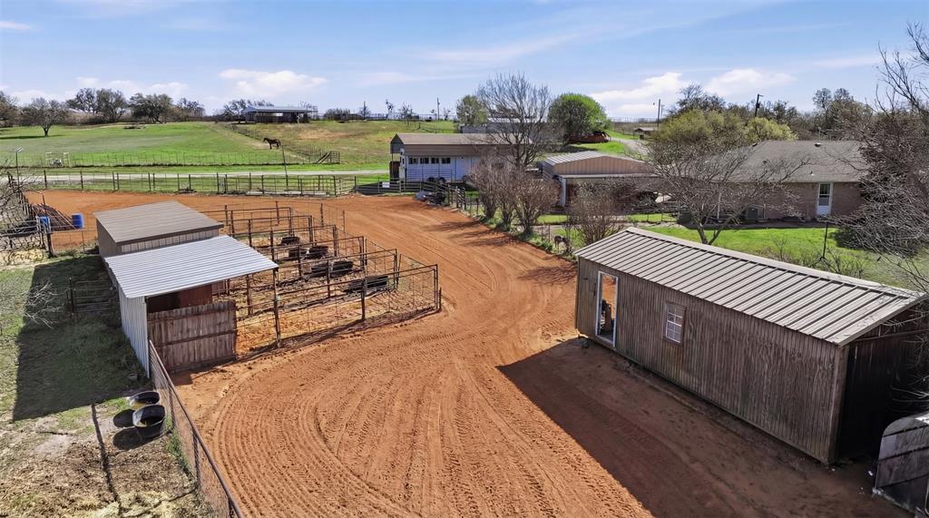 1644 County Road 195 Dublin, TX 76446 - Photo 23 of 34 a view of a chairs and table on the terrace