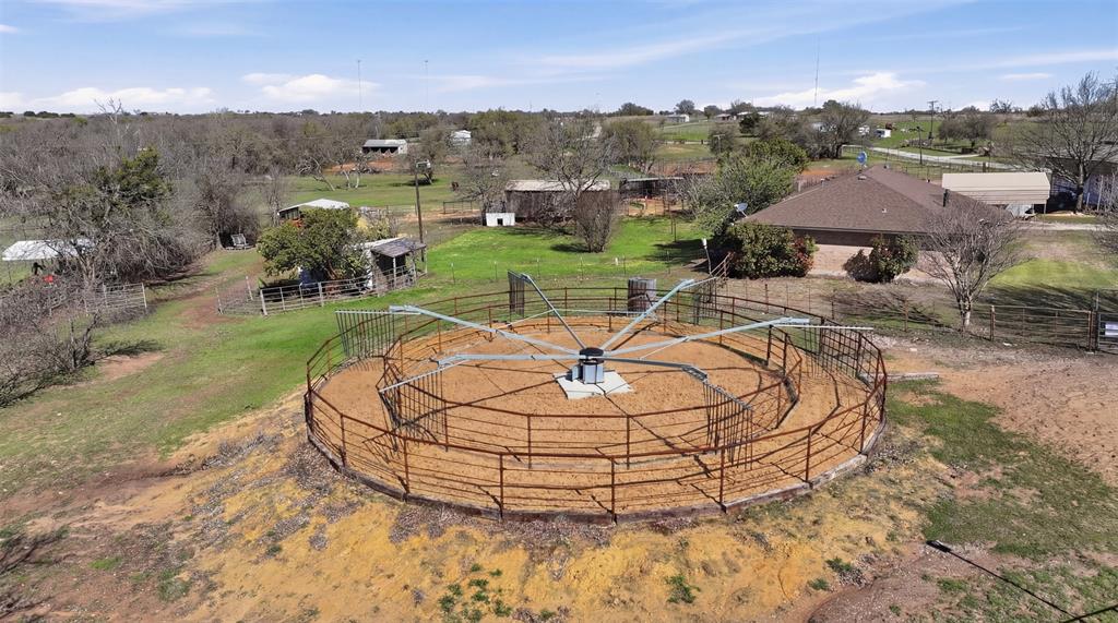 1644 County Road 195 Dublin, TX 76446 - Photo 28 of 34 a view of a swimming pool with a yard