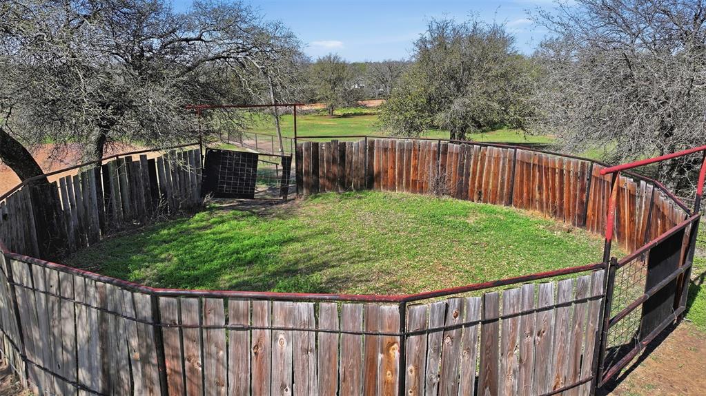 1644 County Road 195 Dublin, TX 76446 - Photo 29 of 34 a view of a backyard with wooden fence