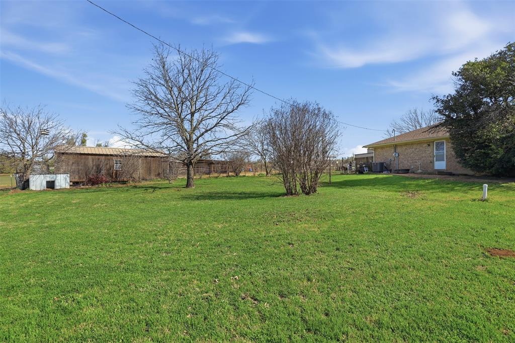 1644 County Road 195 Dublin, TX 76446 - Photo 6 of 34 a view of a house with a big yard