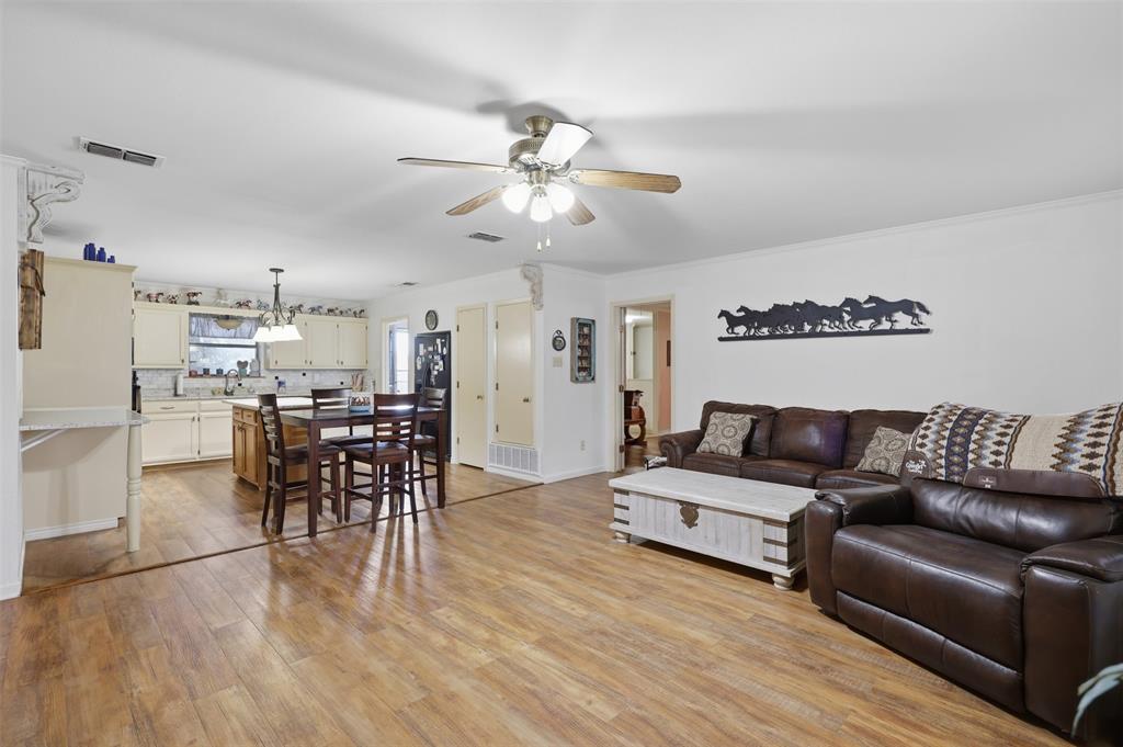 1644 County Road 195 Dublin, TX 76446 - Photo 8 of 34 a living room with furniture and kitchen view
