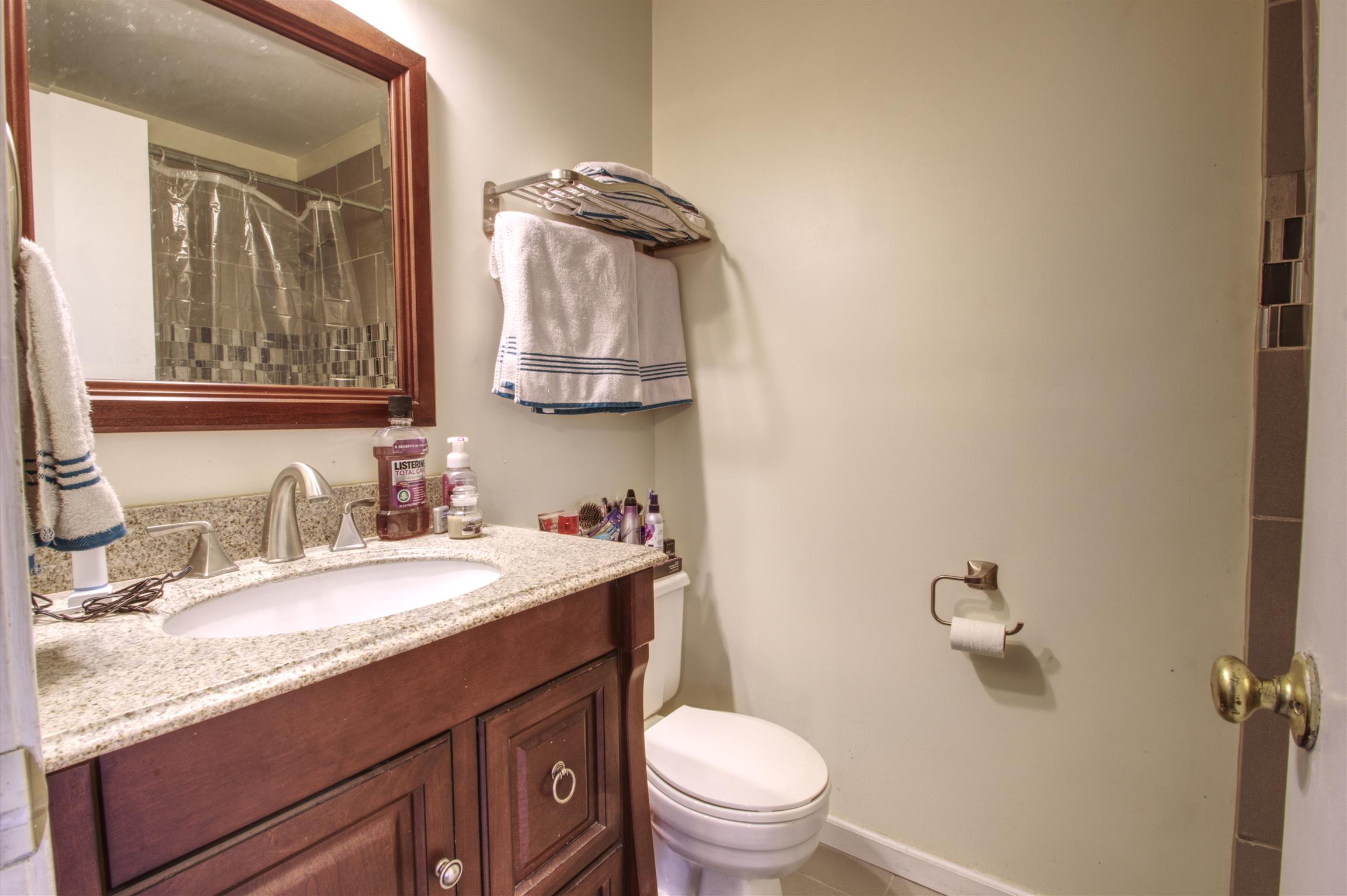 804 Fall Court Antioch, TN 37013 - Photo 13 of 14 a bathroom with a granite countertop sink mirror vanity and toilet