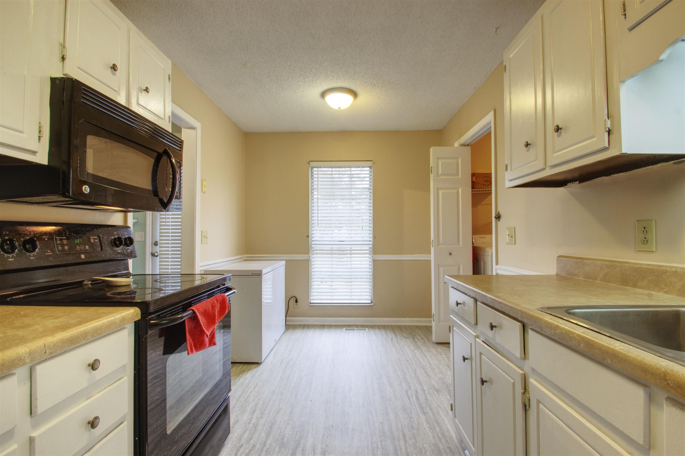 804 Fall Court Antioch, TN 37013 - Photo 7 of 14 a kitchen with a sink microwave and cabinets