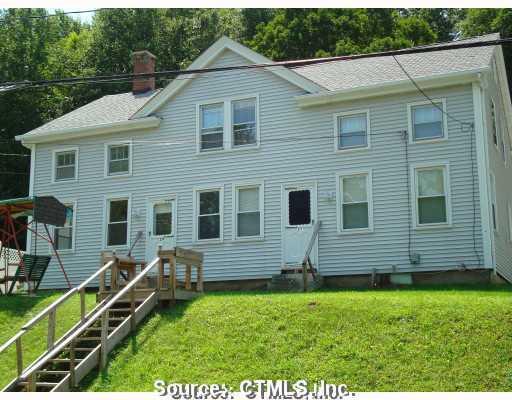 217 High Street Sprague, CT 06330 - Photo 1 of 1 a front view of a house with a yard