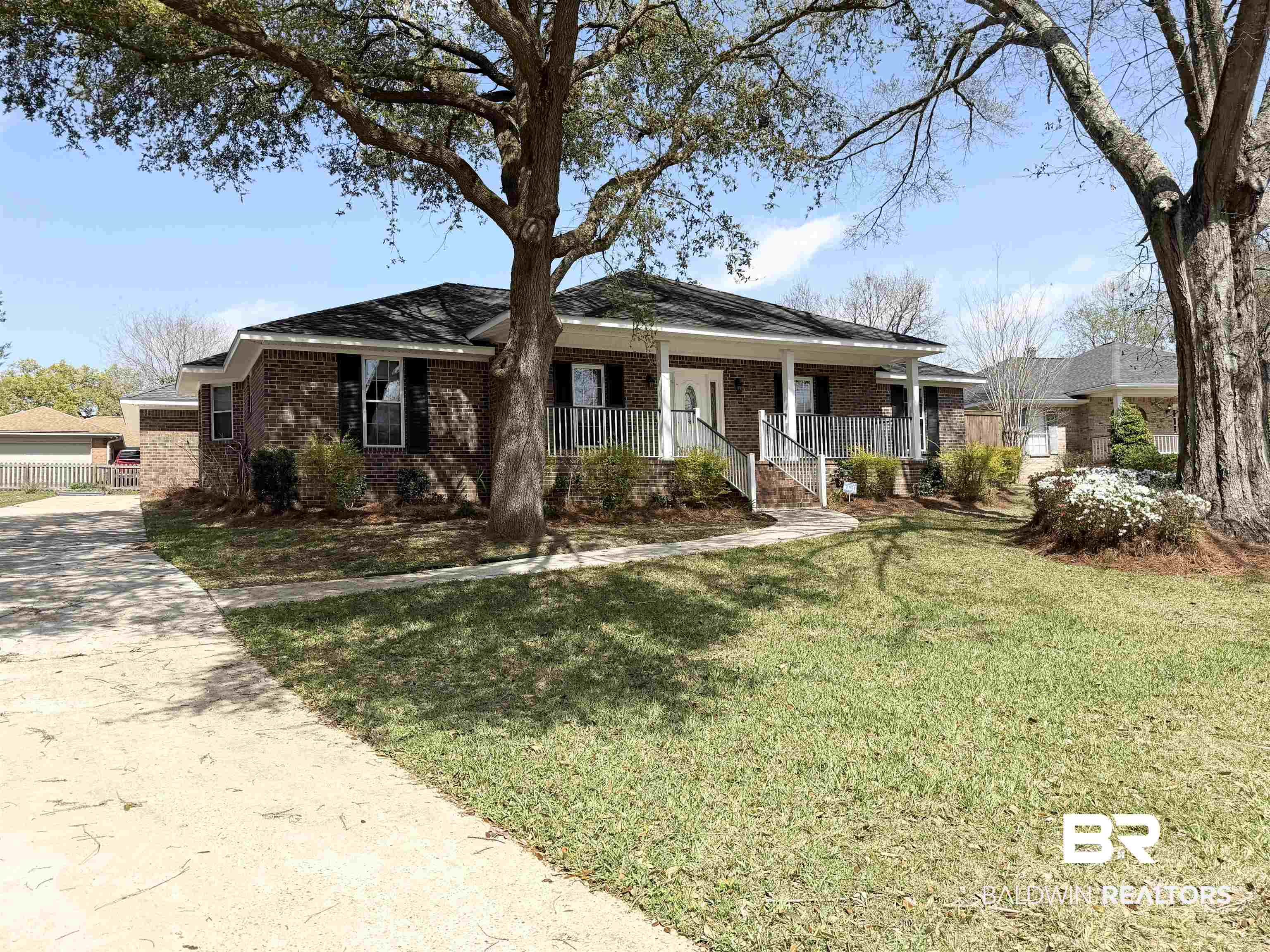 7310 Cheryl Court Mobile, AL 36695 - Photo 2 of 23 Ranch-style home featuring covered porch and brick siding