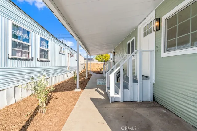 a front view of a house with a fence